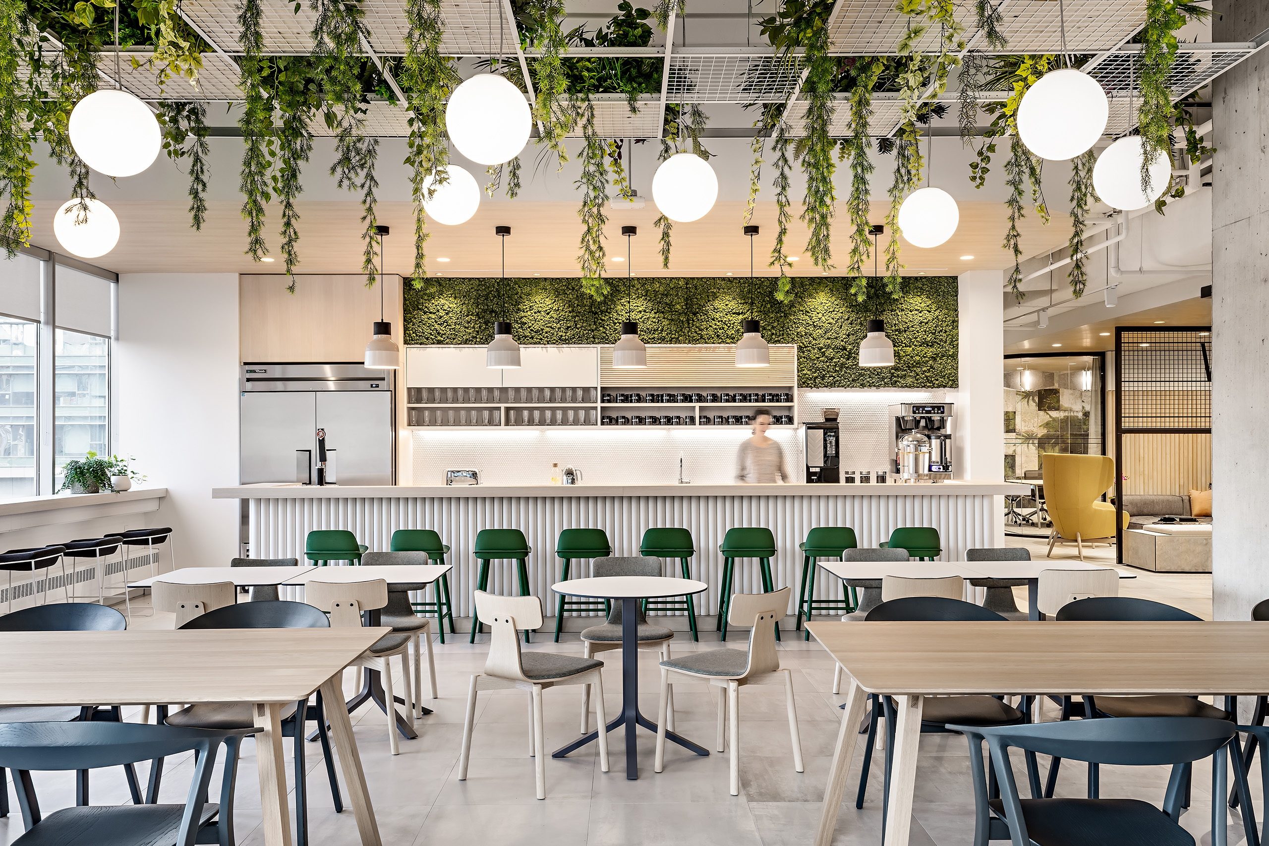 Bar at office kitchen with green accents