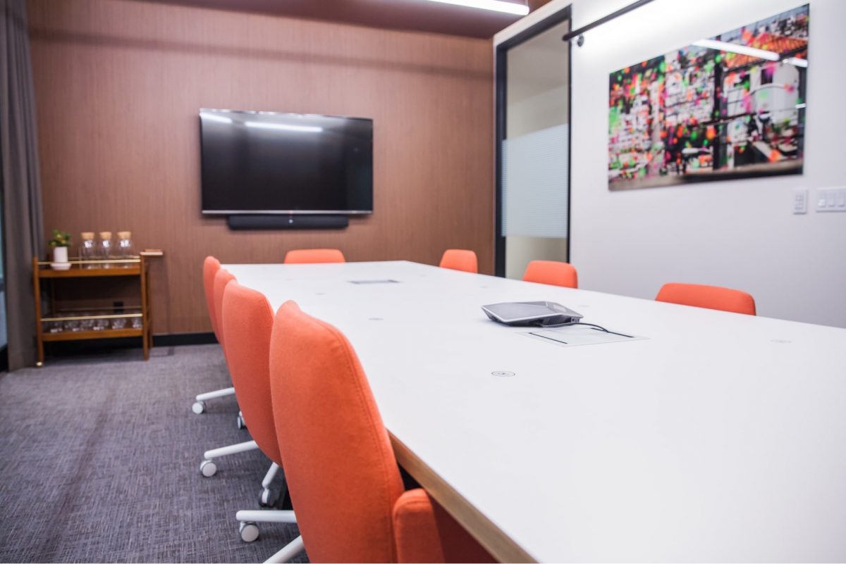 Large meeting room with orange chairs at Workplace One Bay-Bloor