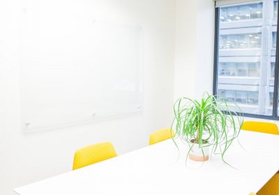 Bright meeting room with yellow chairs at Workplace One Bay-Bloor