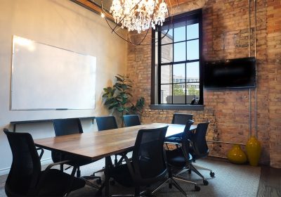 Meeting rom with brick walls and whiteboard