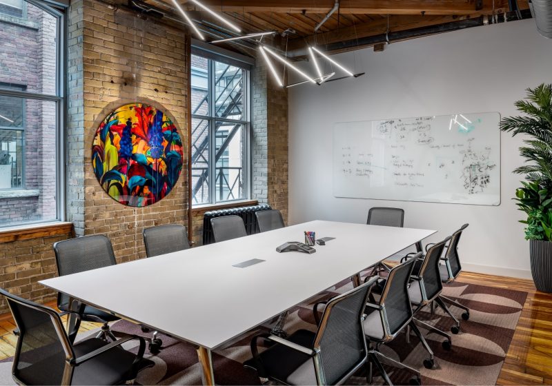 Meeting room with colourful artwork at Workplace One King East