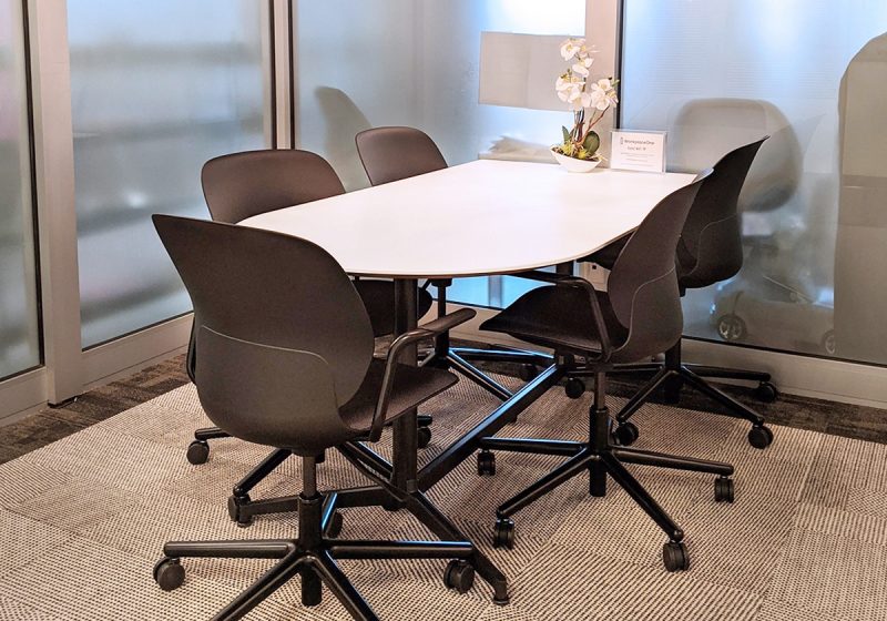 Small meeting room with black chairs at Workplace One King East
