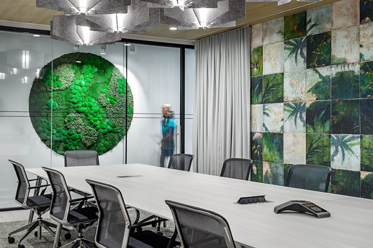 Meeting room in shared workspace with moss walls