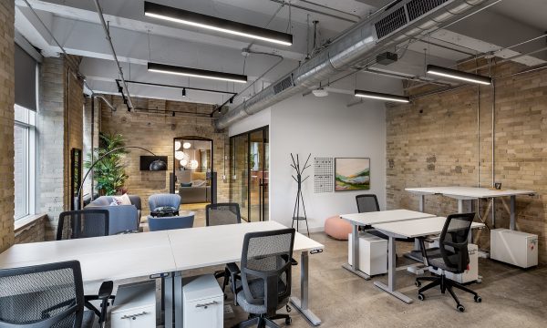 Team suite with brick walls at Workplace One King East